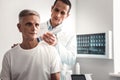 Man in white shirt coming to professional chiropractor