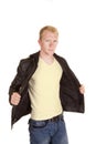 Man in white shirt holding black jacket open Royalty Free Stock Photo