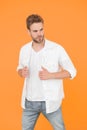 man in white shirt. Muscular man in jeans yellow background. fashion and people concept. Sexy and handsome. Confident Royalty Free Stock Photo