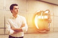 Man in white shirt near open vault on a sunny day Royalty Free Stock Photo