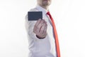 A man in a white shirt and red tie is holding a clean credit card for the inscription, white background business