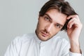 Man in white shirt sitting at the table Royalty Free Stock Photo