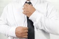 Man in white shirt taking off neck tie Royalty Free Stock Photo