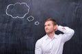 Man in white shirt thinking hard Royalty Free Stock Photo