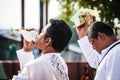 Man in white uniform at Thai traditional religious ceremony