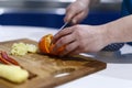 man who cuts citrus on a wooden hoe Royalty Free Stock Photo