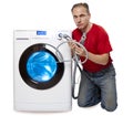 Man who has thought of repair or connection of the washing machine near the new washing machine Royalty Free Stock Photo