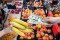 Man who takes care of his health buys fruit in a store