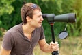Man who is watching in spotting scope. Royalty Free Stock Photo