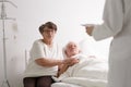 Man with wife listening diagnosis Royalty Free Stock Photo