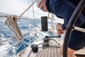 man on winch setting sail in boat regatta Royalty Free Stock Photo