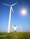 Man and wind turbines under sky Royalty Free Stock Photo