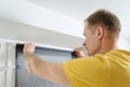 Man with window blind. Royalty Free Stock Photo