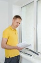 Man with window blind. Royalty Free Stock Photo