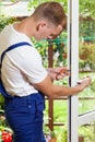 Man during window frame reparation Royalty Free Stock Photo