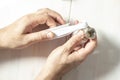 Man winds fum tape on a heating radiator faucet. Royalty Free Stock Photo