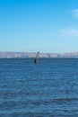 A man windsurfing at Palo Alto Boat Launch, California , USA