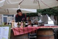 Man at Wine and Ham Stall Royalty Free Stock Photo