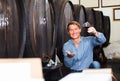 Man wine maker holding wineglass for tasting