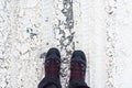 Man in winter boots standing in snow Royalty Free Stock Photo