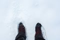 Man in winter boots standing in snow Royalty Free Stock Photo