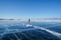 Man in winter jacket travel on frozen Baikal lake in Irkutsk, russia in early February