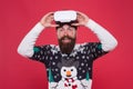 Man winter sweater play game. indoor vs outdoor activity. Virtual reality. man wearing virtual reality goggles. xmas