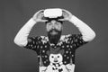 Man winter sweater play game. indoor vs outdoor activity. Virtual reality. man wearing virtual reality goggles. xmas