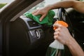 Man wipes car interior with a rag, hand auto wash Royalty Free Stock Photo