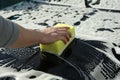 Man wipes the car with a sponge Car wash. Clear car concept