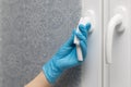 man wipes the doorknob with a napkin. r Royalty Free Stock Photo