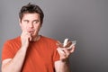 Man wishes to get himself some ice cream. Young man eating ice cream with chocolate.