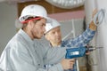 Man wit hardhat drilling wall Royalty Free Stock Photo