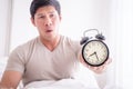 Man woke up late and show alarm clock to camera Royalty Free Stock Photo