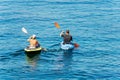 Man and Woman Kayaking in the Blue Water of the Sea - Liguria Italy Royalty Free Stock Photo