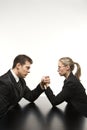 Man and woman arm wrestling Royalty Free Stock Photo