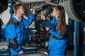 Man and woman in auto mechanics