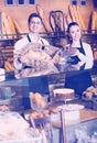 Man and woman bakers in bakery