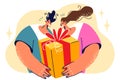 Man and woman with big gift box smiling anticipating emotion of friend who will get birthday present Royalty Free Stock Photo