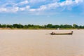 A man and a woman in a boat on the Irrawaddy river in Mandalay, Myanmar, Burma. Copy space for text.