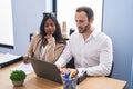 Man and woman business workers using laptop working at office Royalty Free Stock Photo