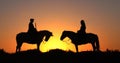 Man and Woman on a Camargue or Camarguais Horse in the Dunes at Sunrise, Manadier in the Camargue in the South East of France, Les Royalty Free Stock Photo