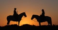 Man and Woman on a Camargue or Camarguais Horse in the Dunes at Sunrise, Manadier in the Camargue in the South East of France, Les Royalty Free Stock Photo