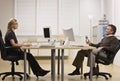 Man and Woman Chatting in Office