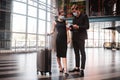 Man and woman checking their boarding passes Royalty Free Stock Photo