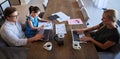 Man, woman and child in home office with laptop, paper documents and kids study homework. Top view of family, mother and Royalty Free Stock Photo