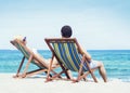 Man and woman chilling on a summer beach Royalty Free Stock Photo