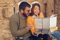 Man and woman Choose a destination at travel at Italy