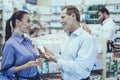 Man and woman buys a medicaments in pharmacy Royalty Free Stock Photo