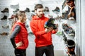 Man and woman choosing shoes for mountain hiking